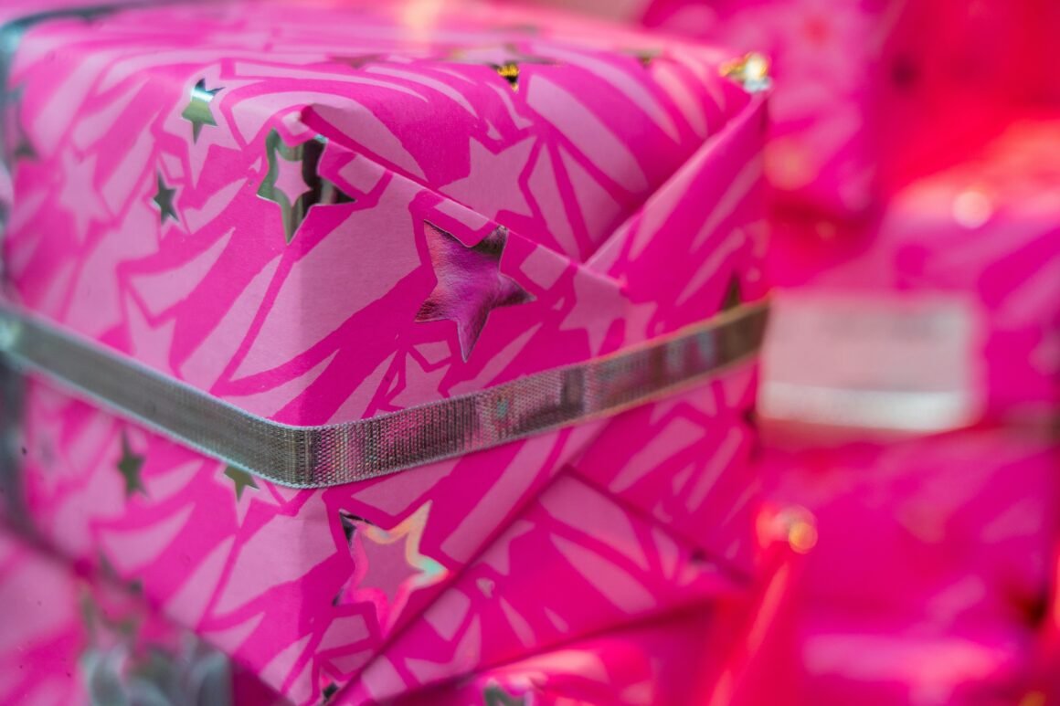 holiday gift wrapped in hot pink wrapping paper