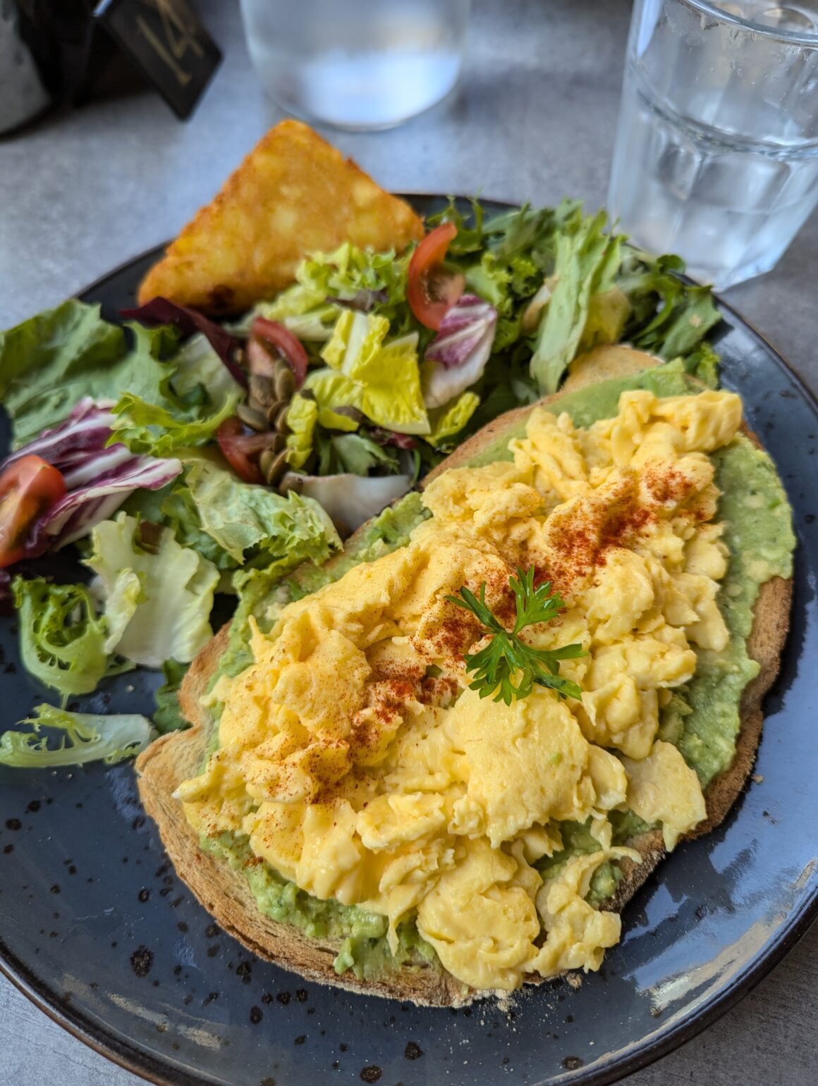 scrambled eggs on avocado toast with side salad for breakfast at The Metro Cafe Dublin