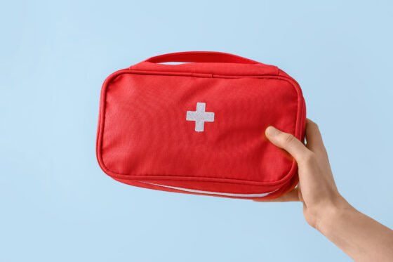 travel medicine kit being held by a woman