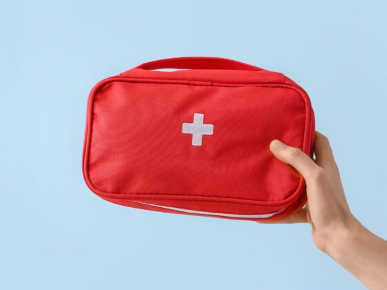travel medicine kit being held by a woman