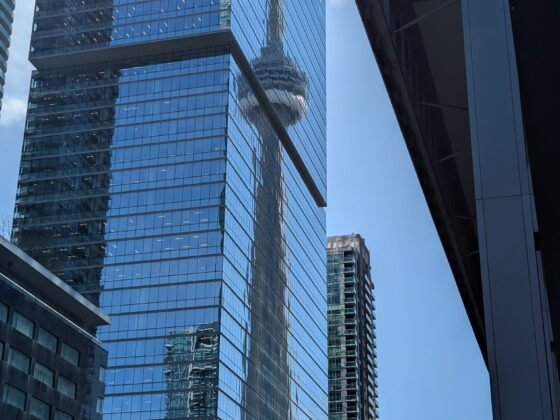 CN Tower reflection on buildings in downtown Toronto, Canada