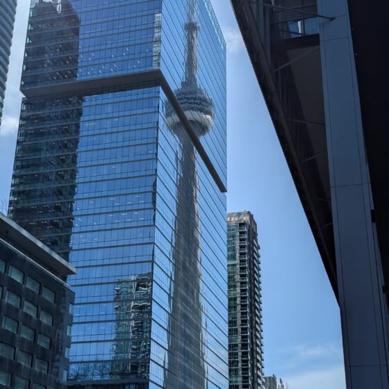 CN Tower reflection on buildings in downtown Toronto, Canada